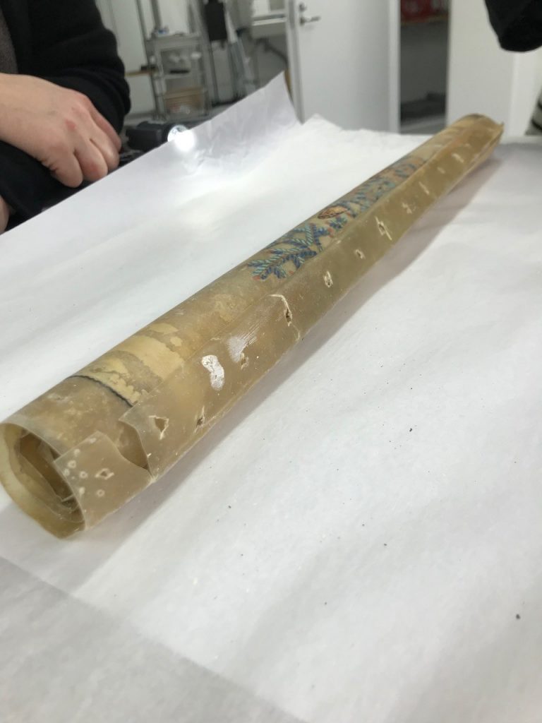 Tightly wrapped parchment roll from Serlachius Collection containing an artwork made by E. O. W. Ehrström.