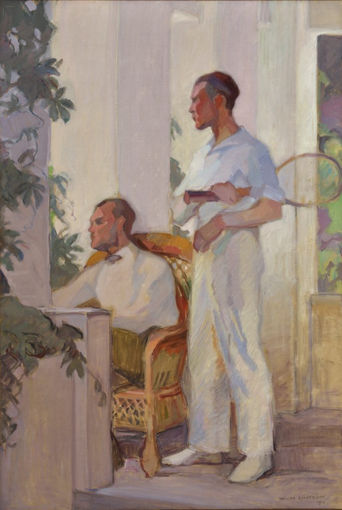 Two elegantly dressed men in their light outfits seem to be tennis players.  One of them sitting the other standing with a tennis racket on his hand on a deck of a White House and gazing into garden as if waiting for something to happen. 