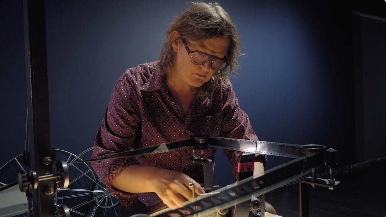 Milja Viita at her film projector.
