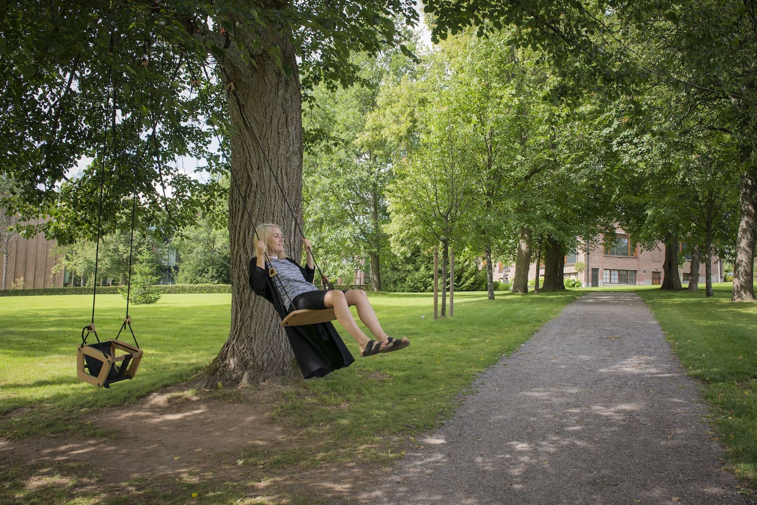 Woman in a swing at Serlachius' Park